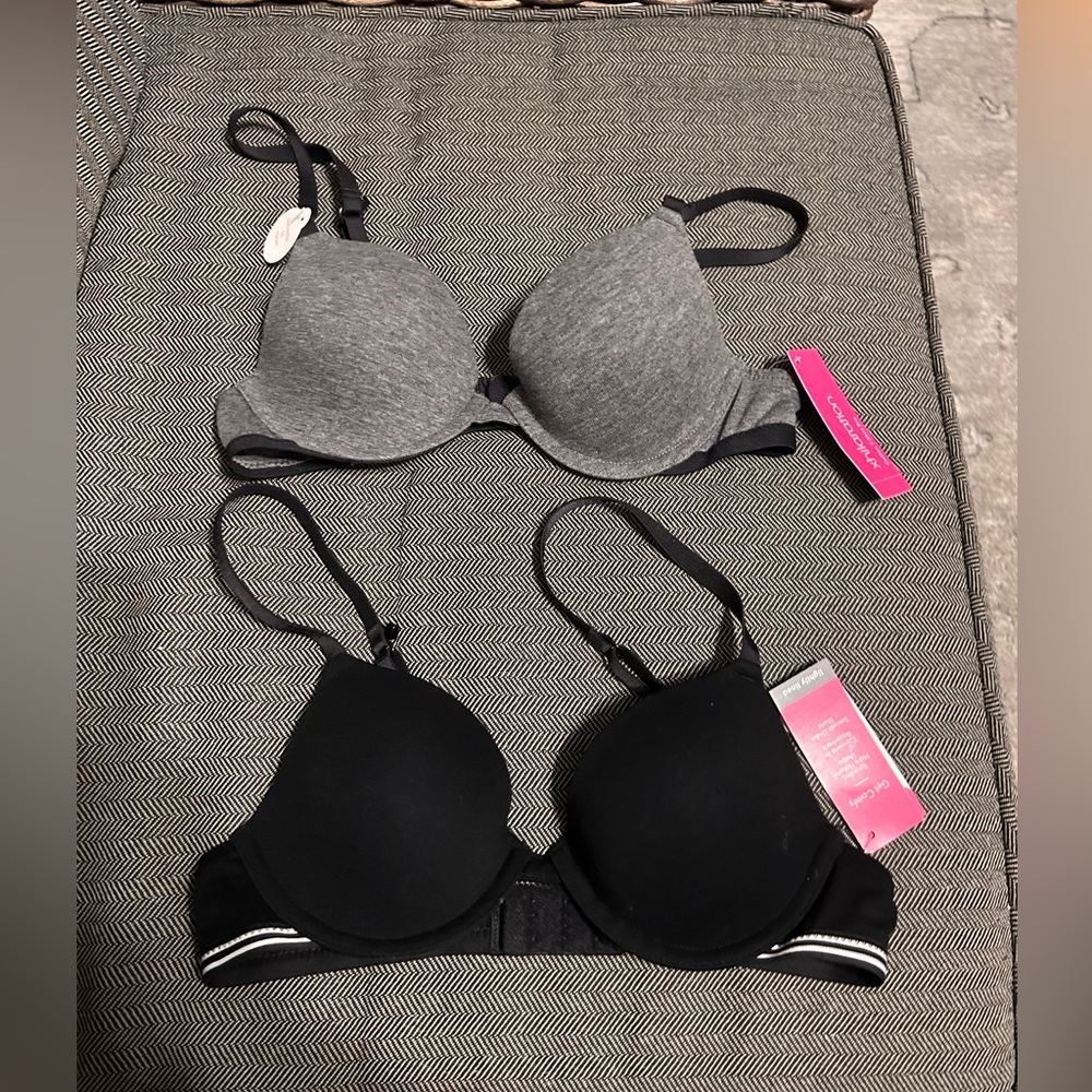 32A bra set. T shirt bra that clips in the back. One black and one grey.